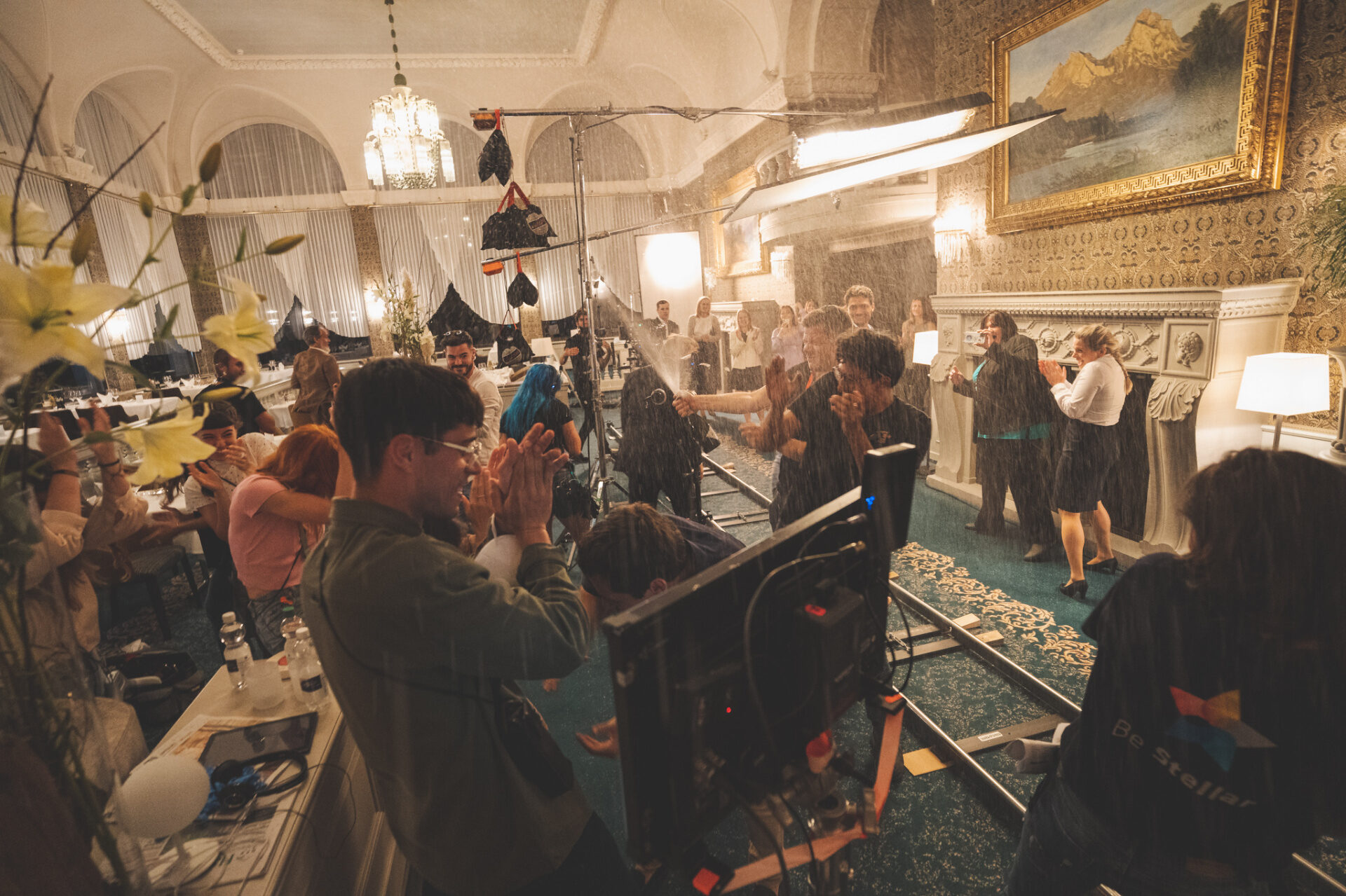 Rain effect on a dolly track inside a Belle Époque grand hall during a Swiss film shoot
